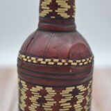 Set of 2 decorative vintage bottles covered with leather & wicker