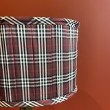 Lamp base in gilded brass, oval silk lampshade with a checkered pattern in burgundy.