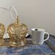 Set of two suspensions in gilded chiseled glass