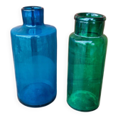 A pair of blue and green glass vases.