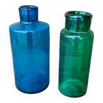 A pair of blue and green glass vases.