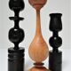Three vintage light and dark wood candlesticks