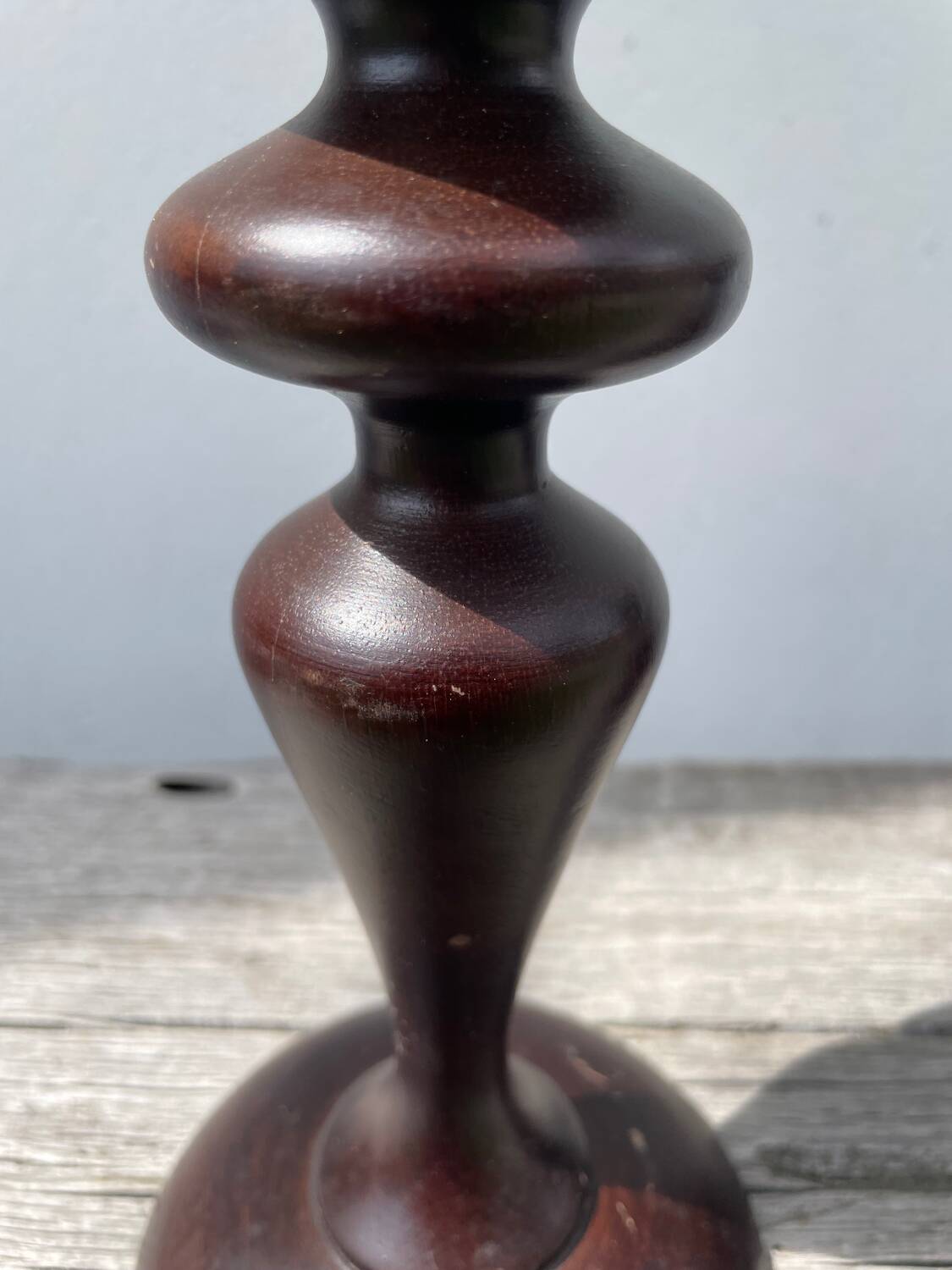 Trio of large turned wooden candlesticks