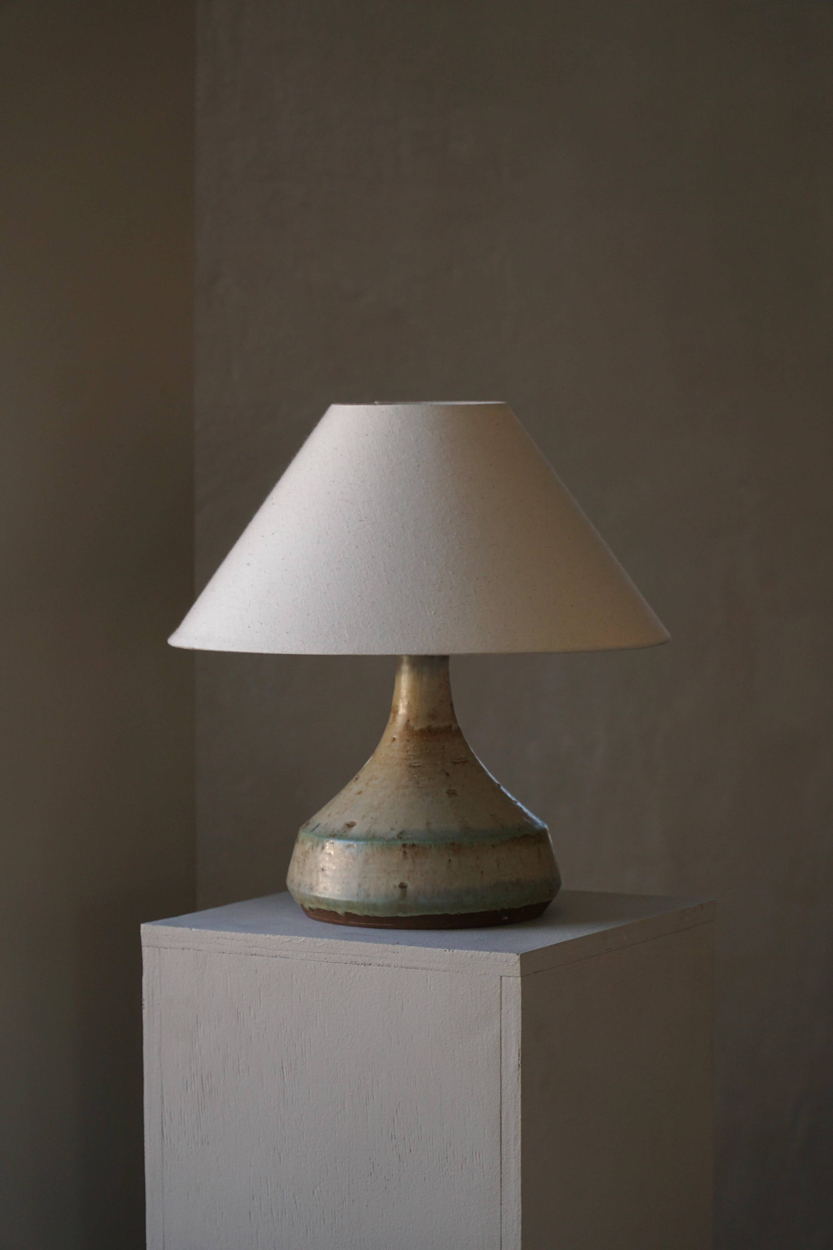 Modern Danish decorative table lamp in stoneware with flared base, Denmark, 1960s.