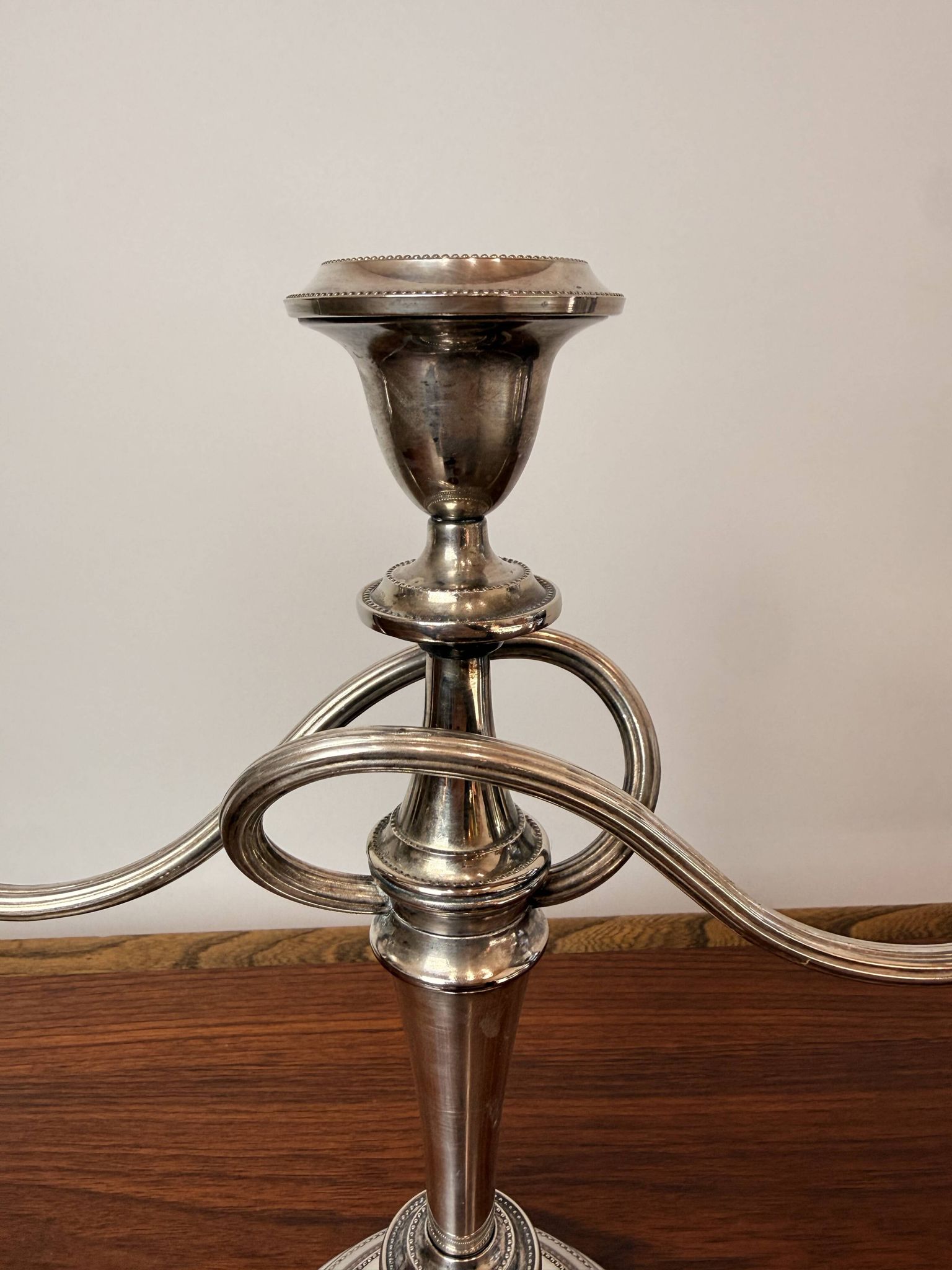 Vintage twisted chandelier with three lights in silver-plated metal.