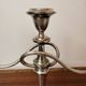 Vintage twisted chandelier with three lights in silver-plated metal.
