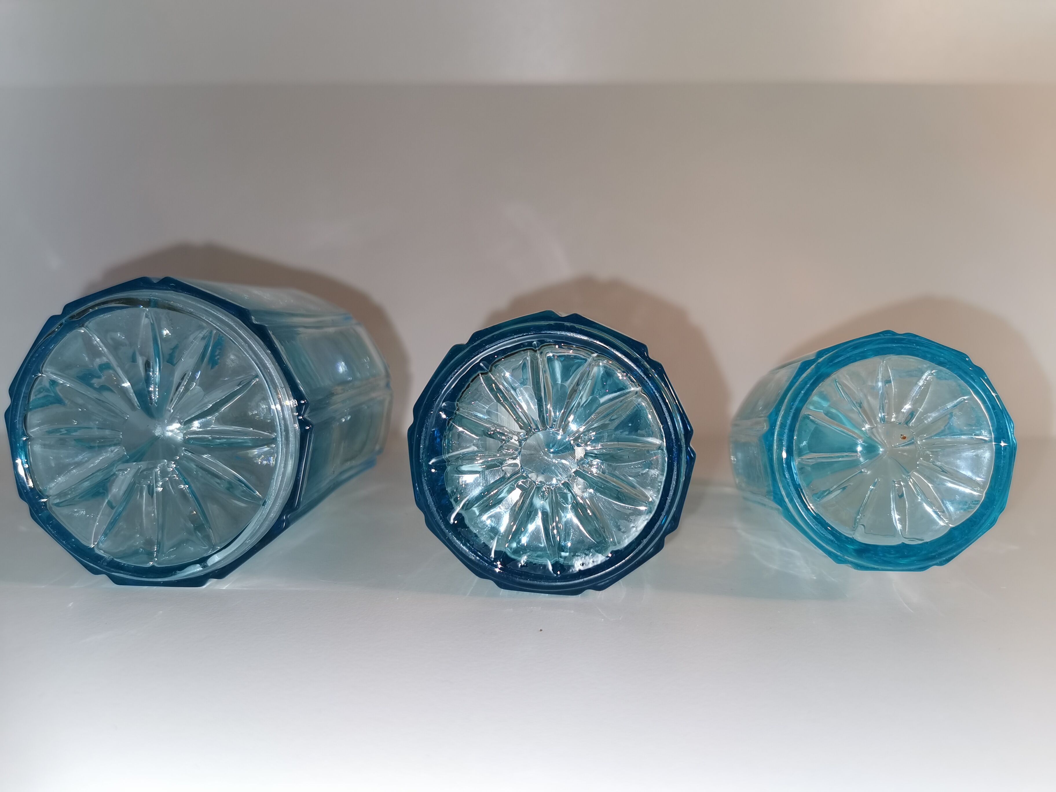 Trilogy of old blue glass bottles