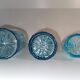 Trilogy of old blue glass bottles