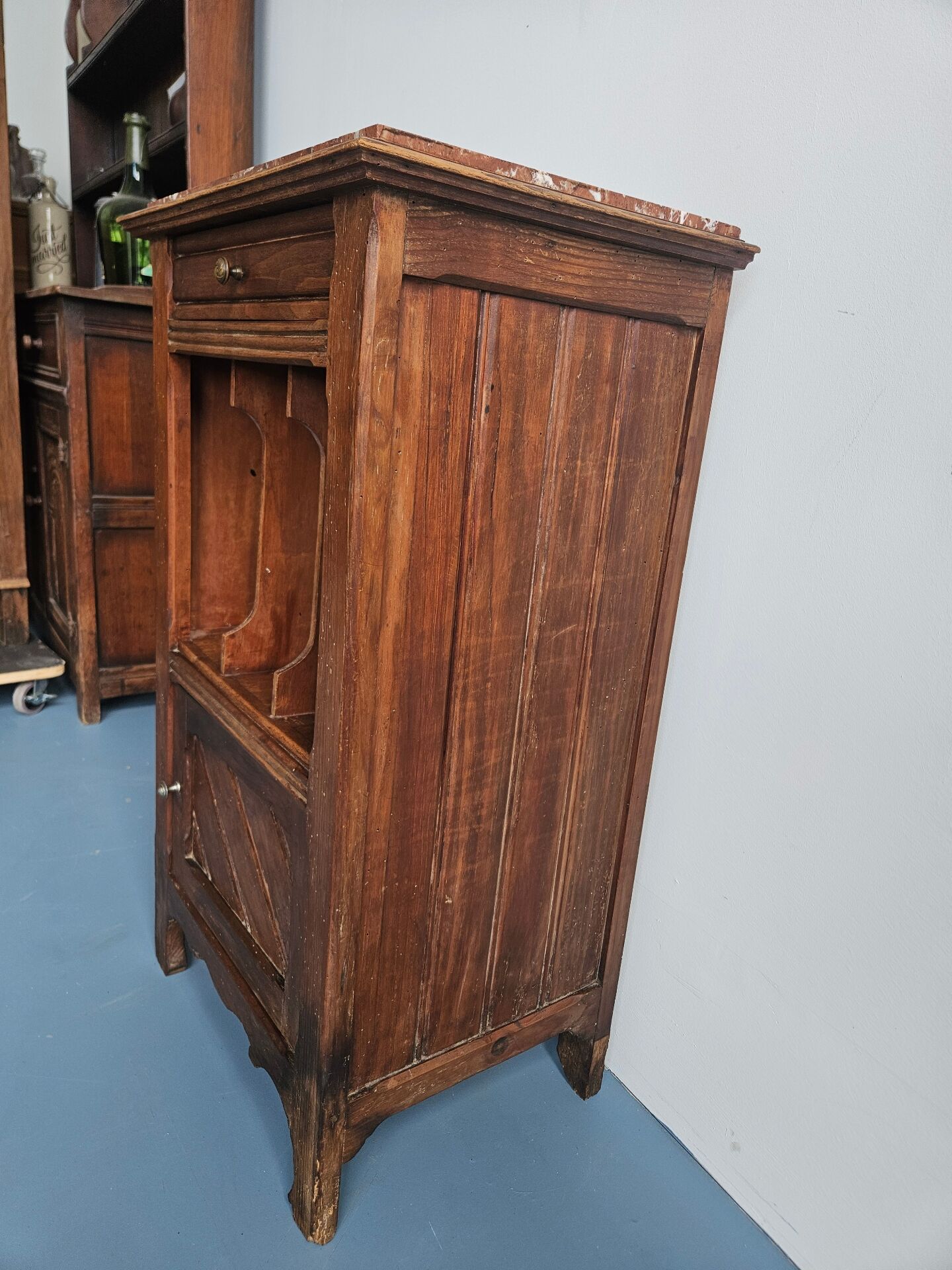 Wooden bedside table with book storage