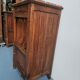 Wooden bedside table with book storage