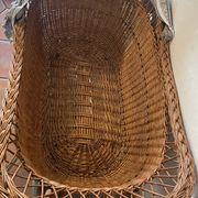 Antique rattan cradle in very good condition. Sold with or without upholstery.