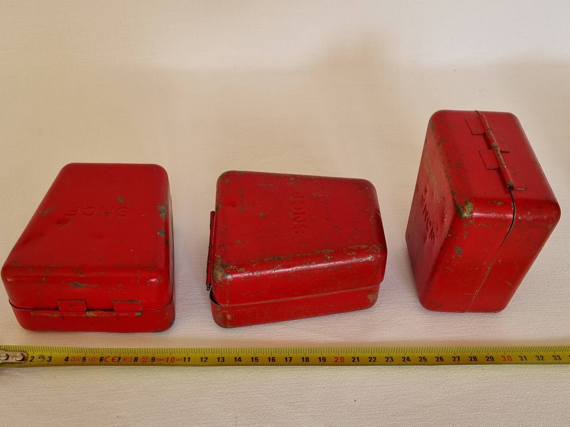 Set of three red painted metal railway boxes with SNCF logo