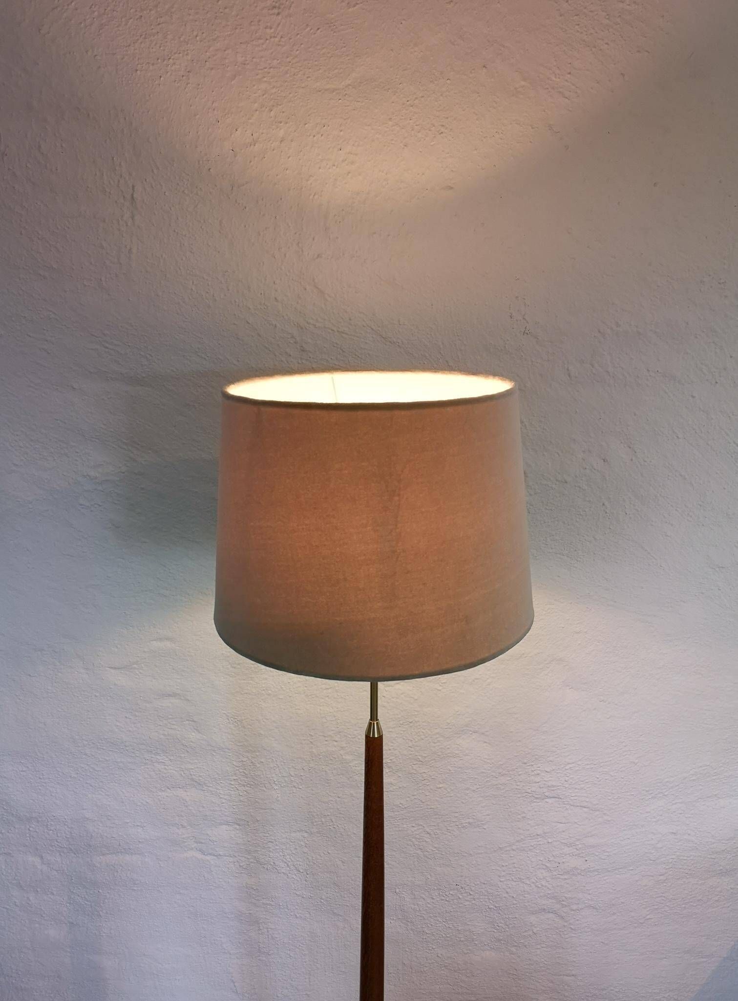 Mid-century floor lamp in teak and brass by Falkenbergs Belysning, Sweden, 1960s.