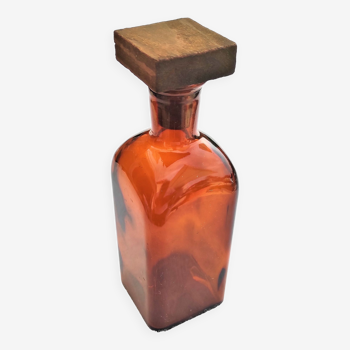 Amber glass bottle with its 5x5 square wooden cap circa 1970