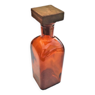 Amber glass bottle with its 5x5 square wooden cap circa 1970