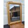 19th-century fireplace mirror in gilded wood and stucco.