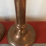 Pair of red brass candlesticks