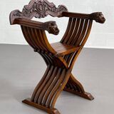 Vintage carved wooden folding armchair
