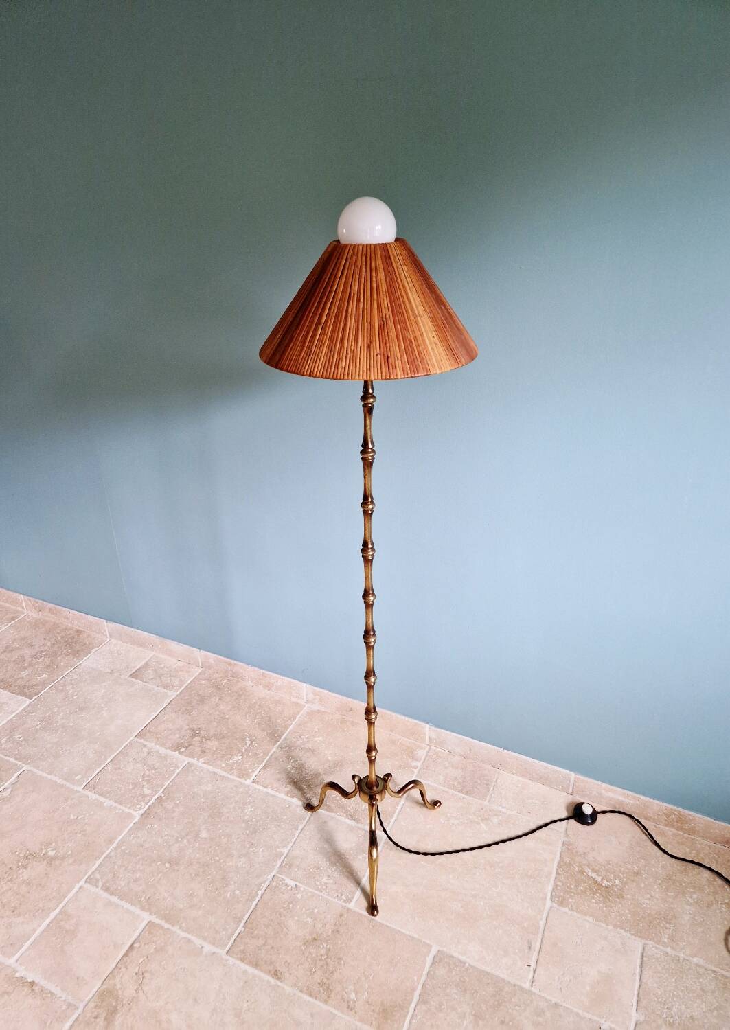 Brass floor lamp with rattan shade, 1950s-60s.