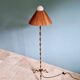 Brass floor lamp with rattan shade, 1950s-60s.