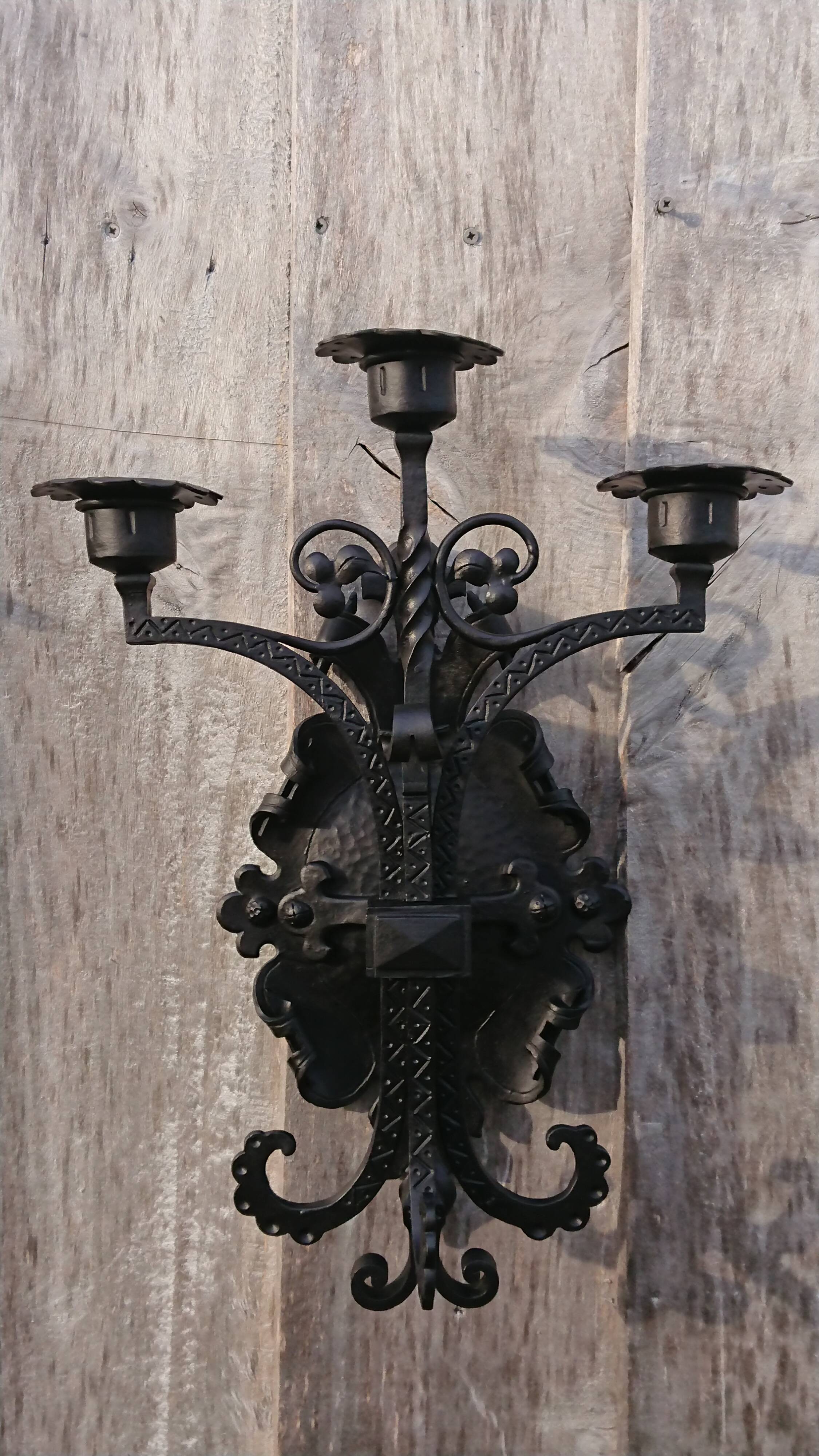 Pair of black wrought iron sconces - neo-Gothic style - from the 1950s