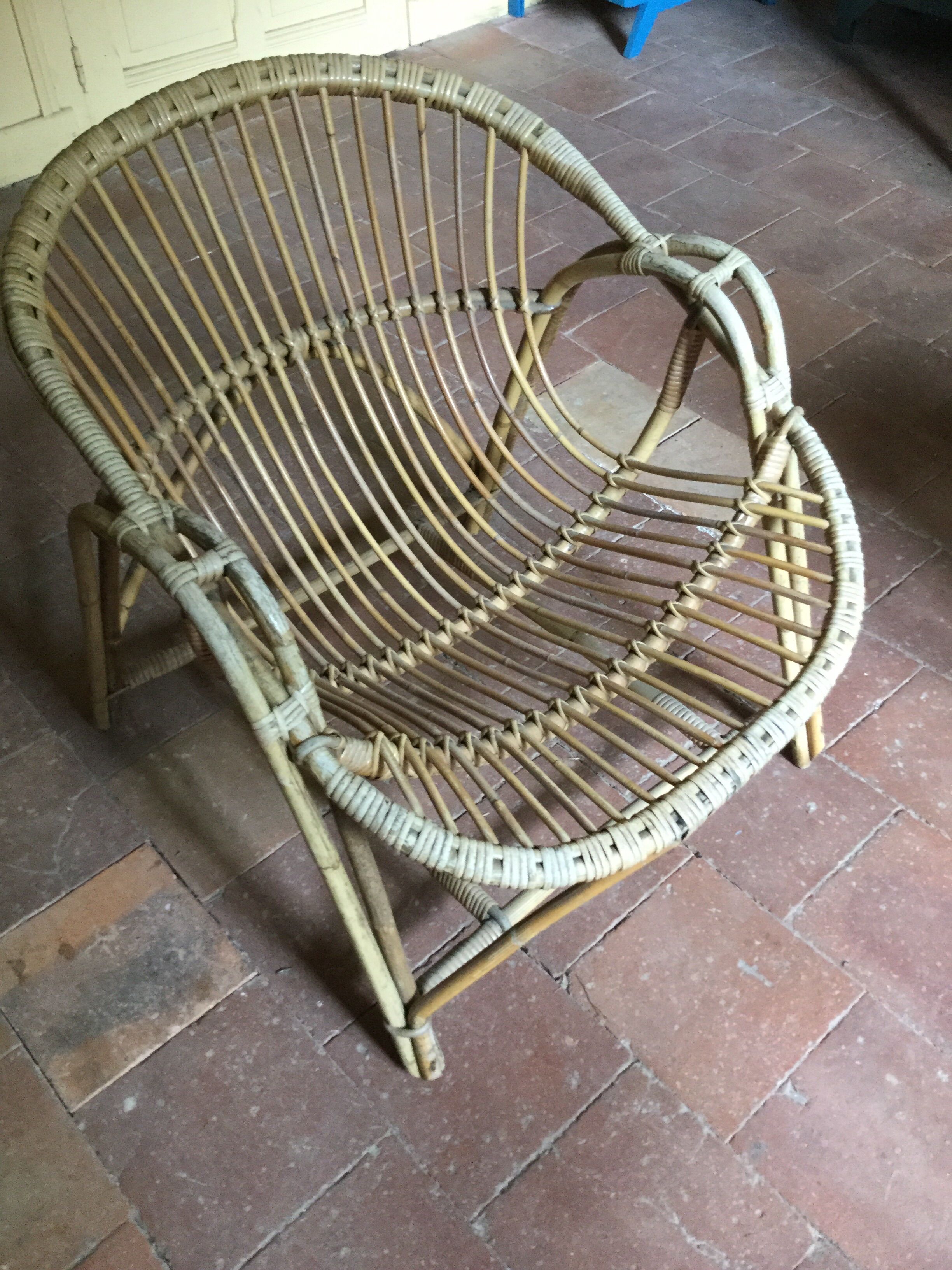 A pair of rattan armchairs