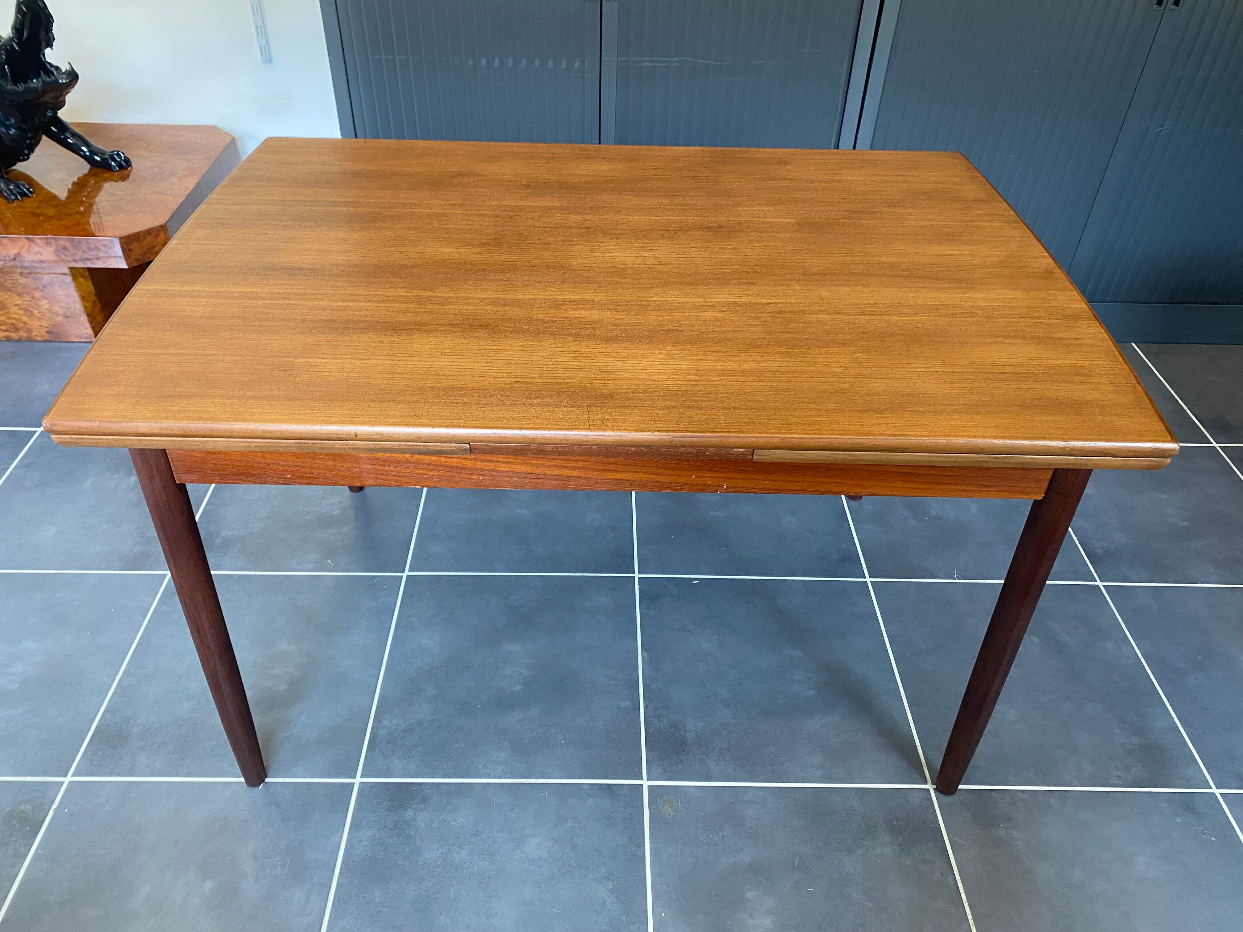 Extendable Scandinavian teak table by Johannes Andersen for Samcom Denmark.