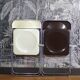 Duo of white and brown Piretti plia chairs