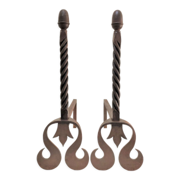 Pair of sculptural cast iron chenets with twisted heads