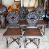 4 stylized dolphin back chairs