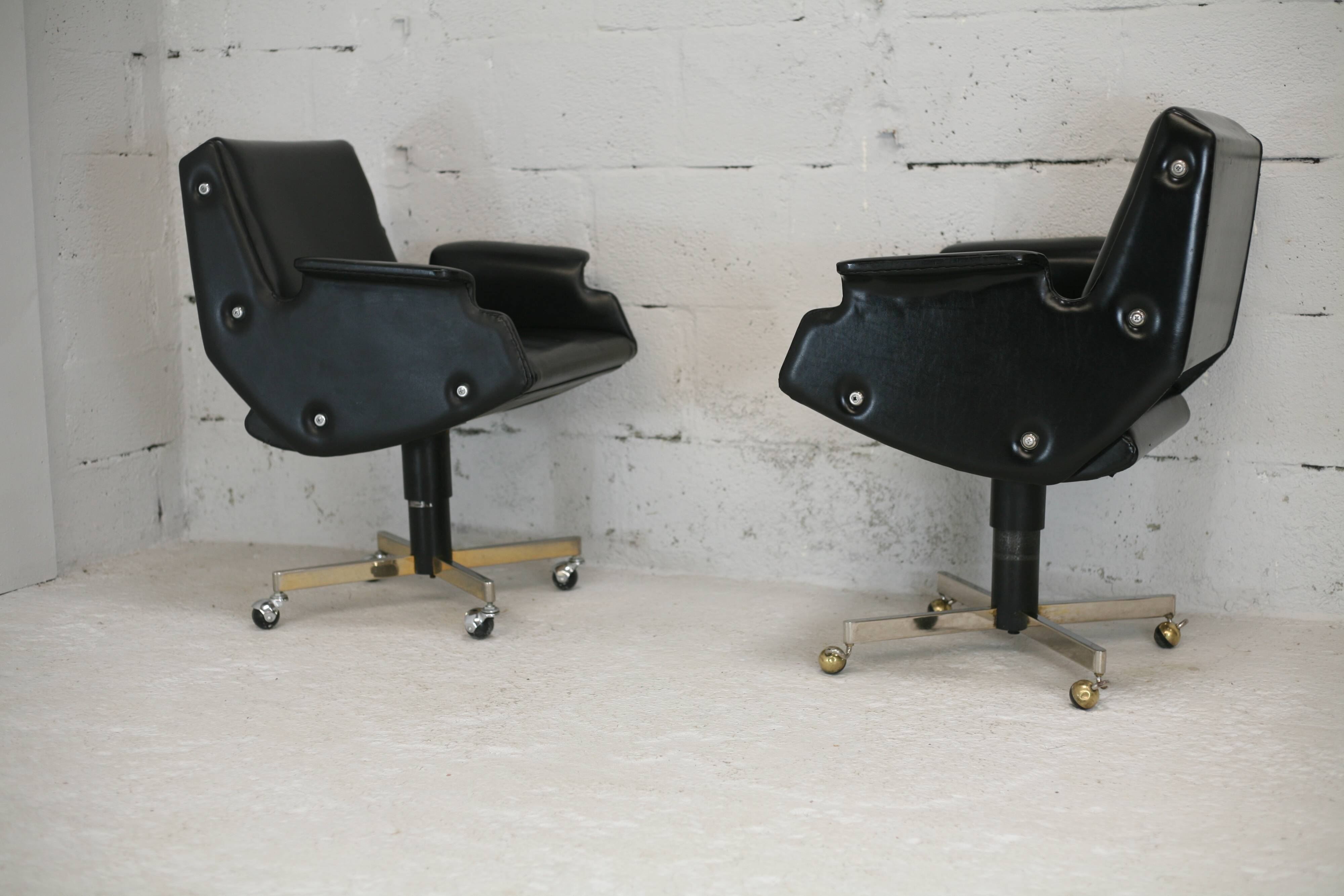 Pair of swivel armchairs, imitation leather and steel, Italy, circa 1960.