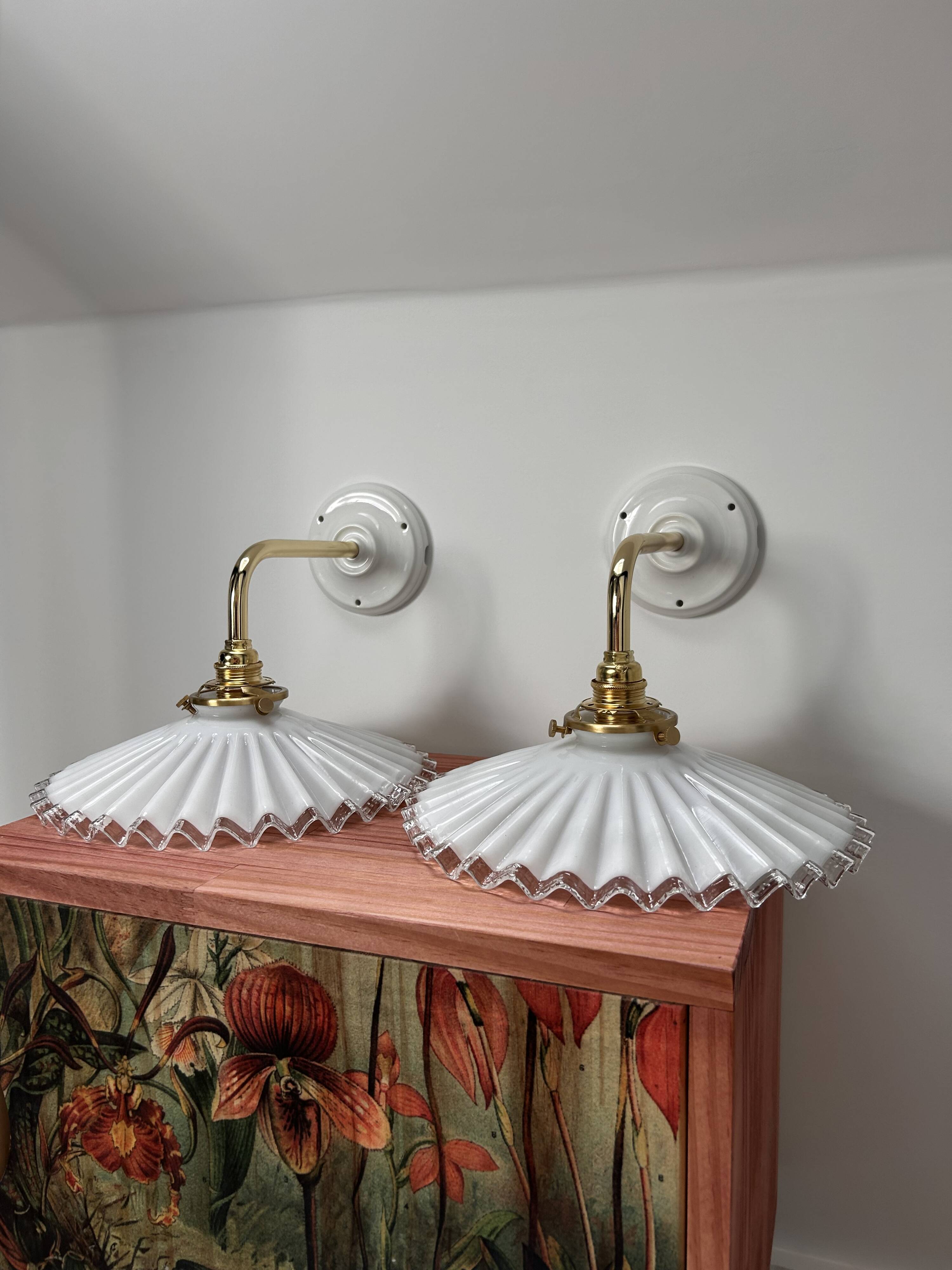 Two wall sconces in serrated white opaline