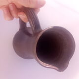 Long pitcher in varnished sandstone