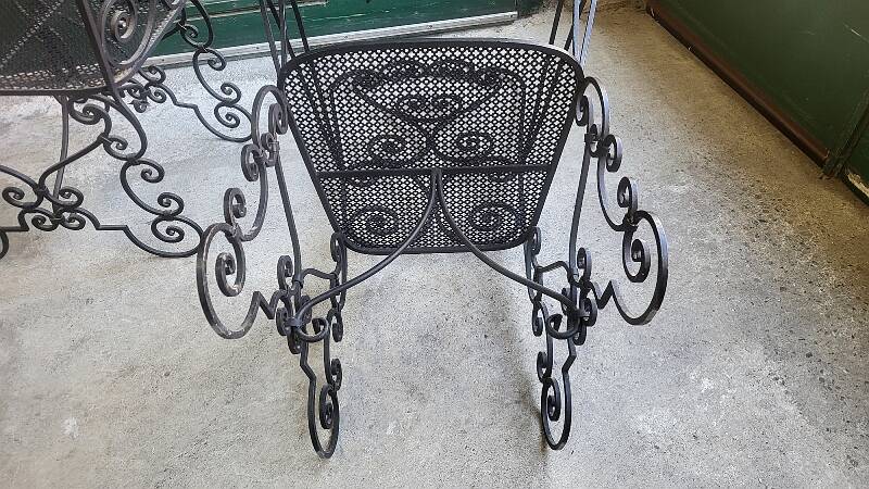 Pair of black wrought iron armchairs