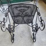 Pair of black wrought iron armchairs