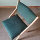 Scandinavian green chairs with tapered legs.