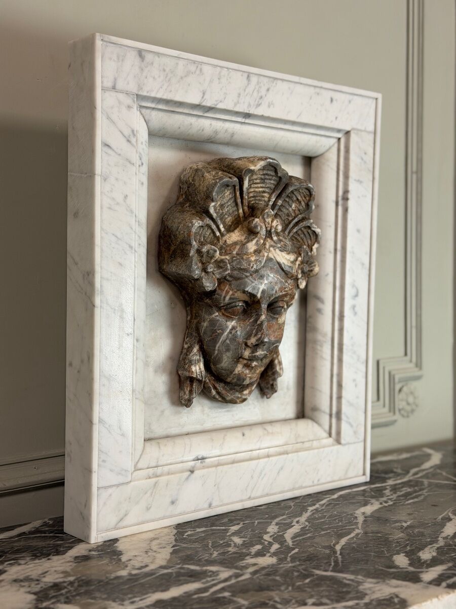 Female mascaron in grey Ardennes marble from the Regency period, 18th century.