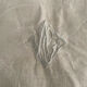 Floral damask cotton tablecloth with central monogram AC.