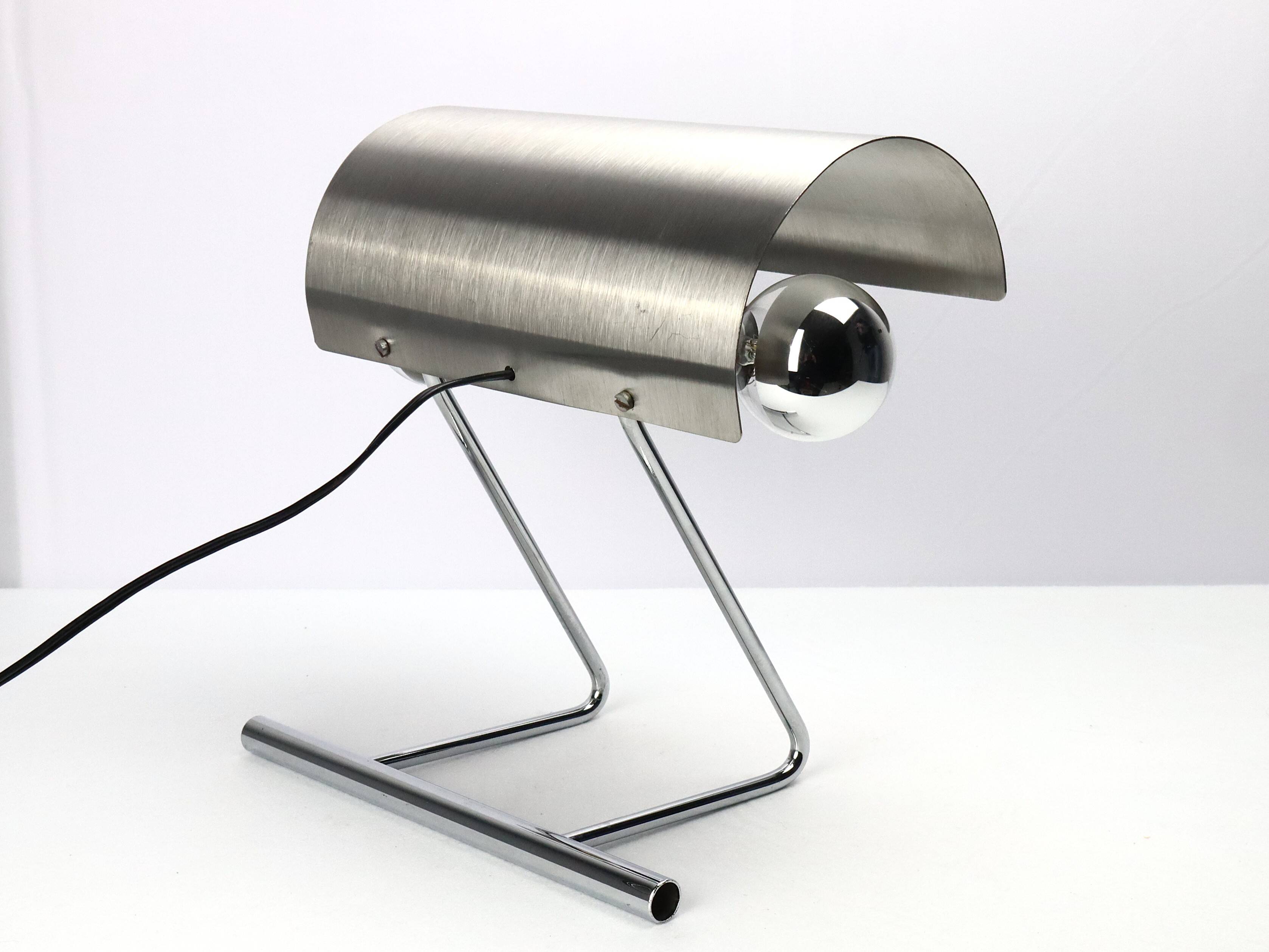 Stainless steel lamp from the 1970s in the style of François Monnet.