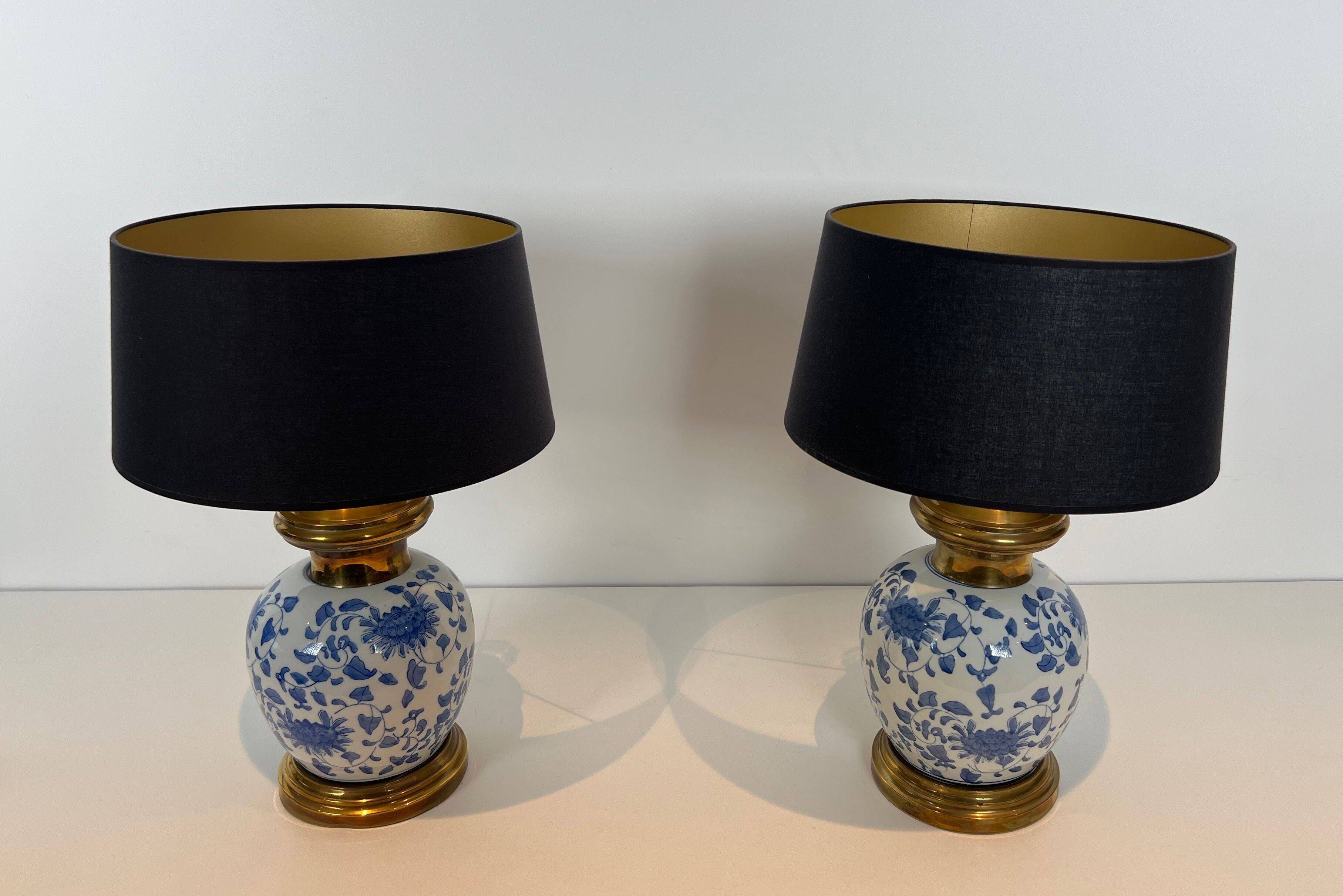 Pair of porcelain lamps with Chinese-style decorations and brass.