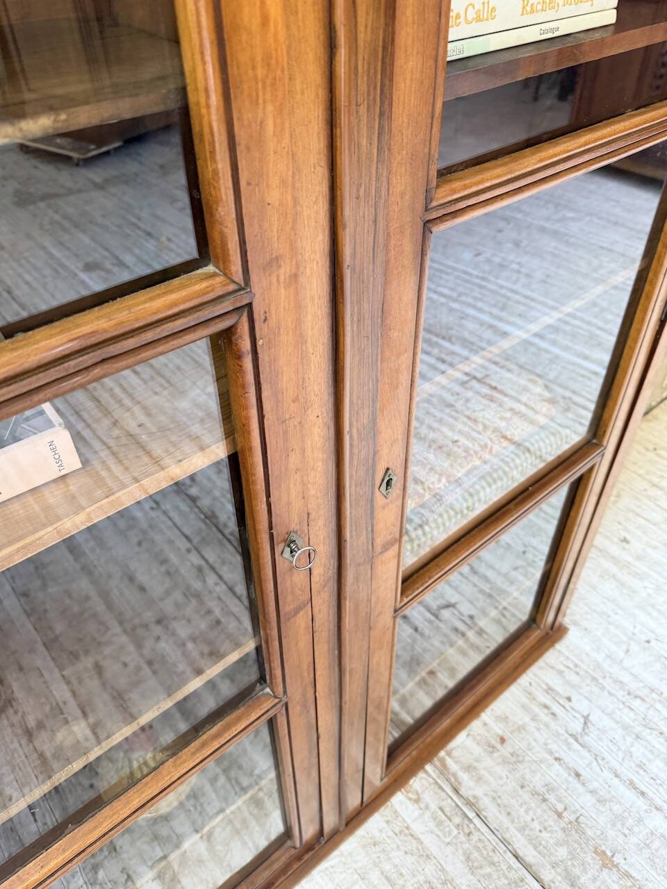 Glass-fronted walnut library 1900