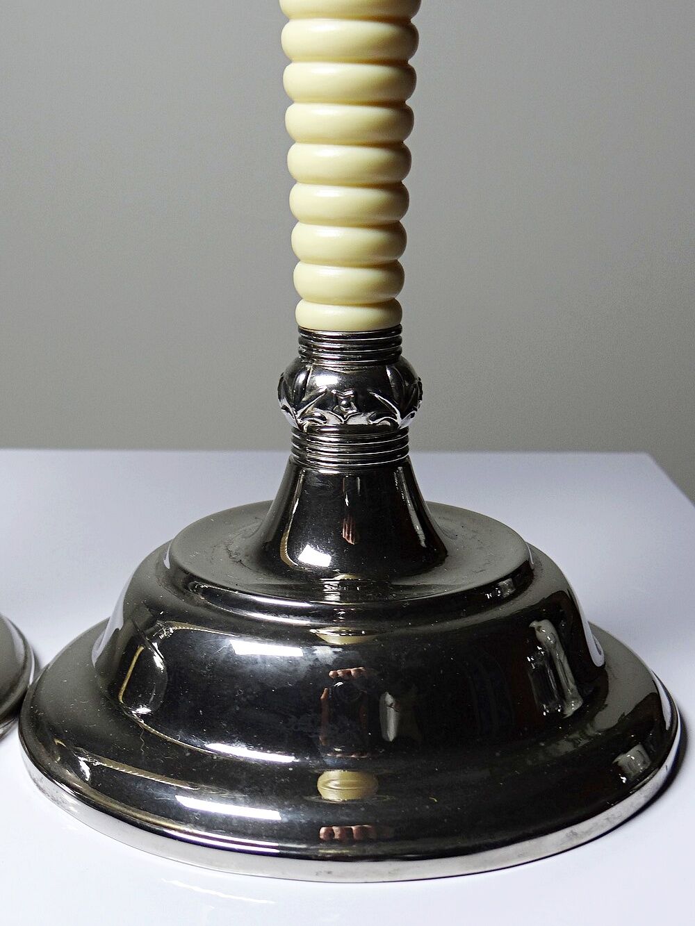Pair of vintage candlestick holders in silver-plated metal with ivory-style plastic.