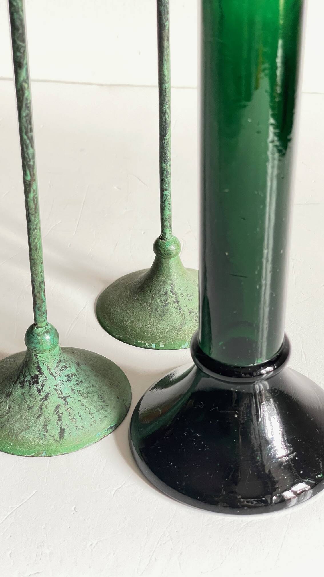Green glass and metal candle holders