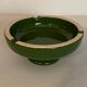 Vintage green ashtray on foot
