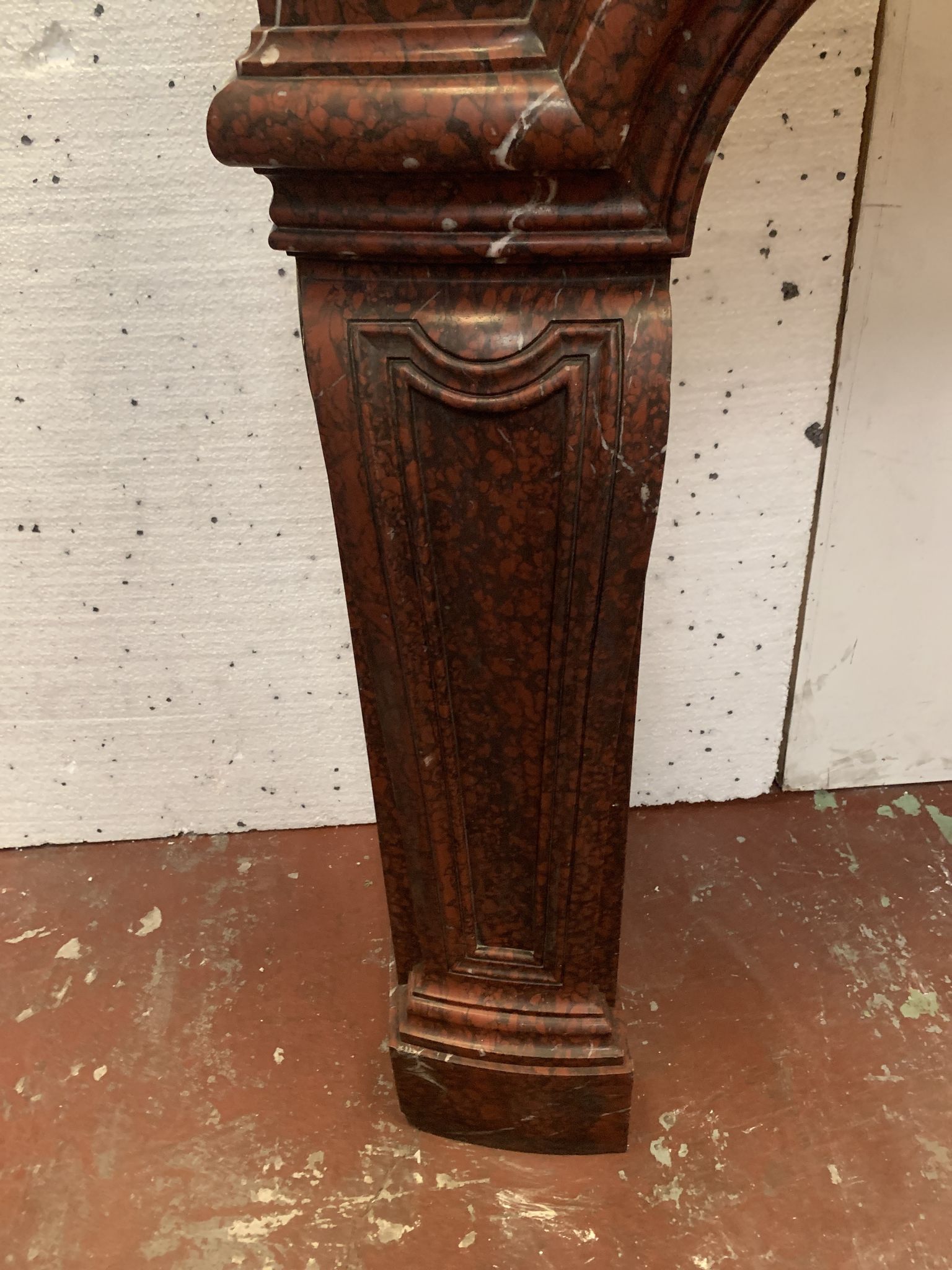 Pair of Louis XIV style fireplaces in red cherry marble. XIX century.