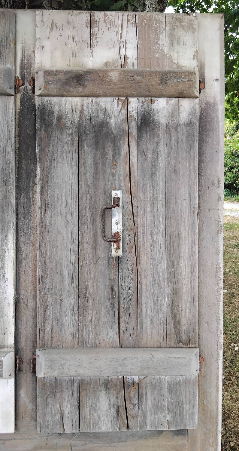 Old door with vintage wooden shutters