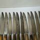 Set of 12 large knives and 11 horn and steel dessert knives