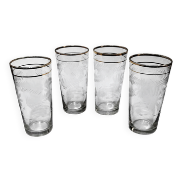 Four engraved crystal glasses from La Granja, with gilded edges, early 20th century.