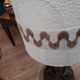Ceramic lamp decorated with foliage