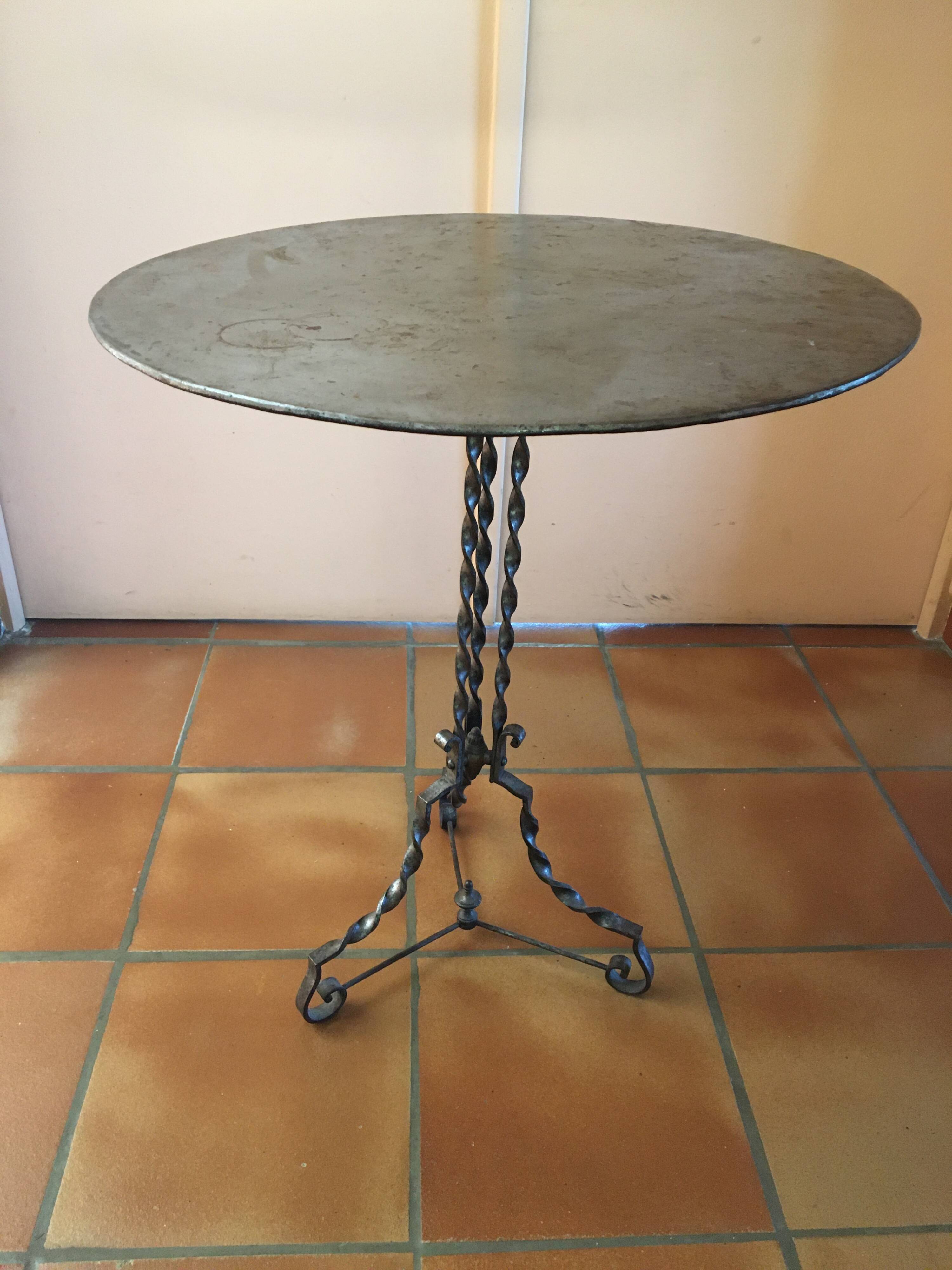 Round and antique metal side table